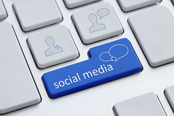 Picture of computer keyboard social media key for social media reach